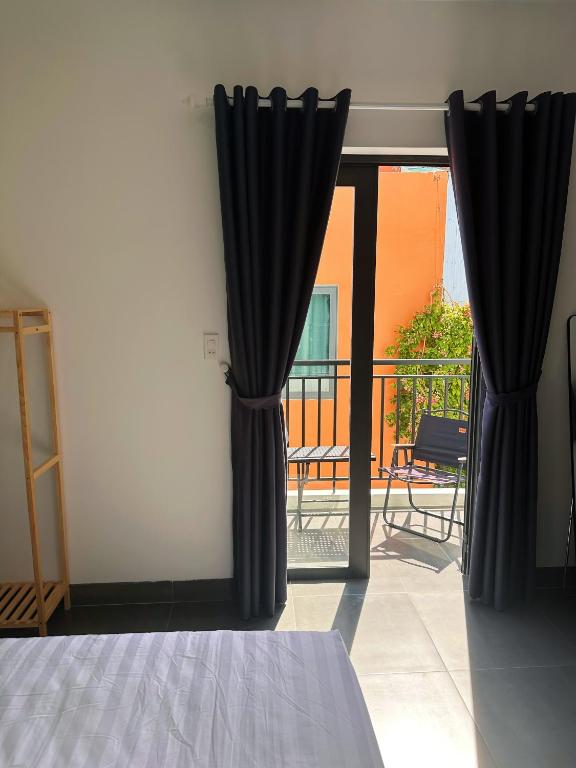 Postel nebo postele na pokoji v ubytování Gito Hostel Hoian