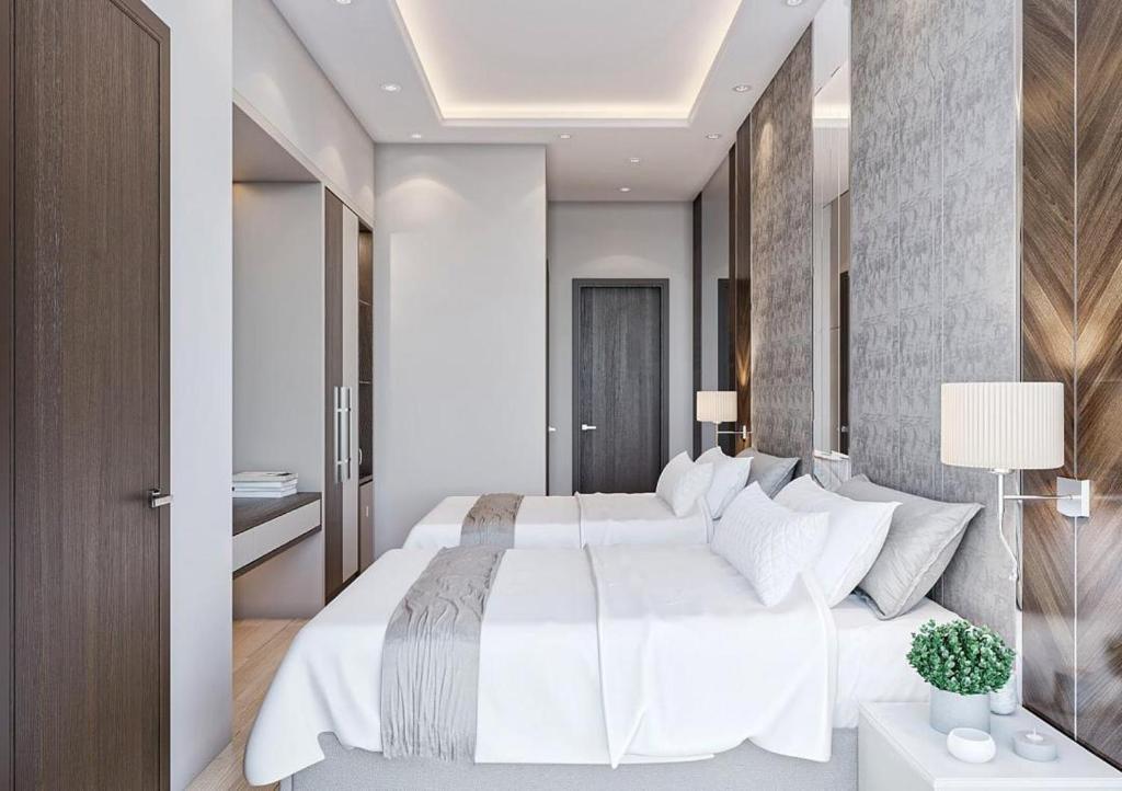 Postel nebo postele na pokoji v ubytování ZARA HoTEL