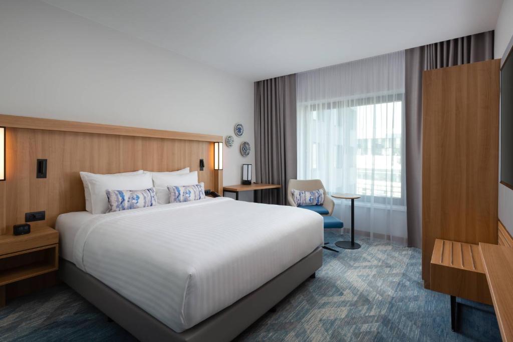 Postel nebo postele na pokoji v ubytování Courtyard by Marriott Bucharest Floreasca