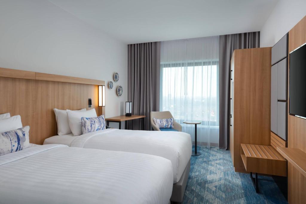Postel nebo postele na pokoji v ubytování Courtyard by Marriott Bucharest Floreasca
