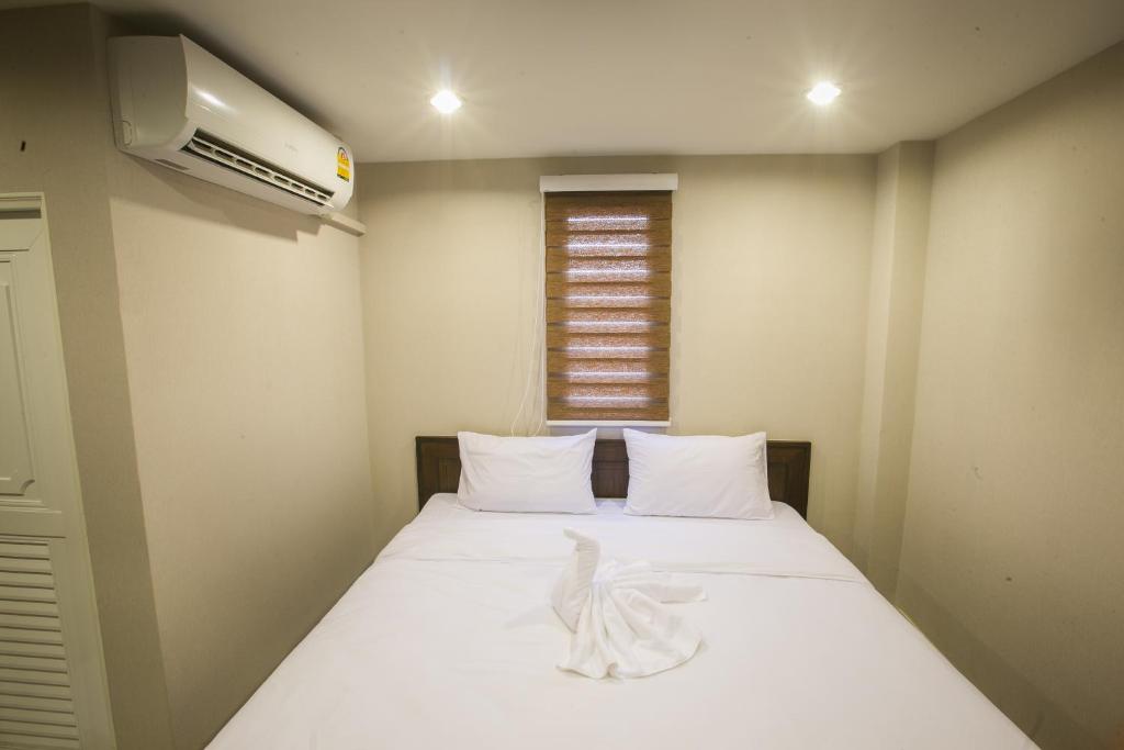 Postel nebo postele na pokoji v ubytování The Sleep Phang-nga