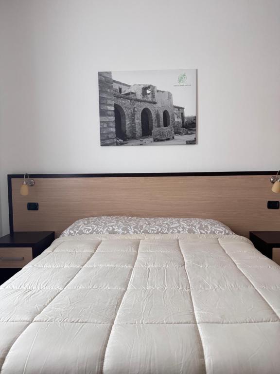 Postel nebo postele na pokoji v ubytování Vecchio Frantoio Villa Rosa