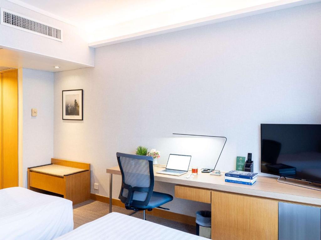Postel nebo postele na pokoji v ubytování Novotel Century Hong Kong