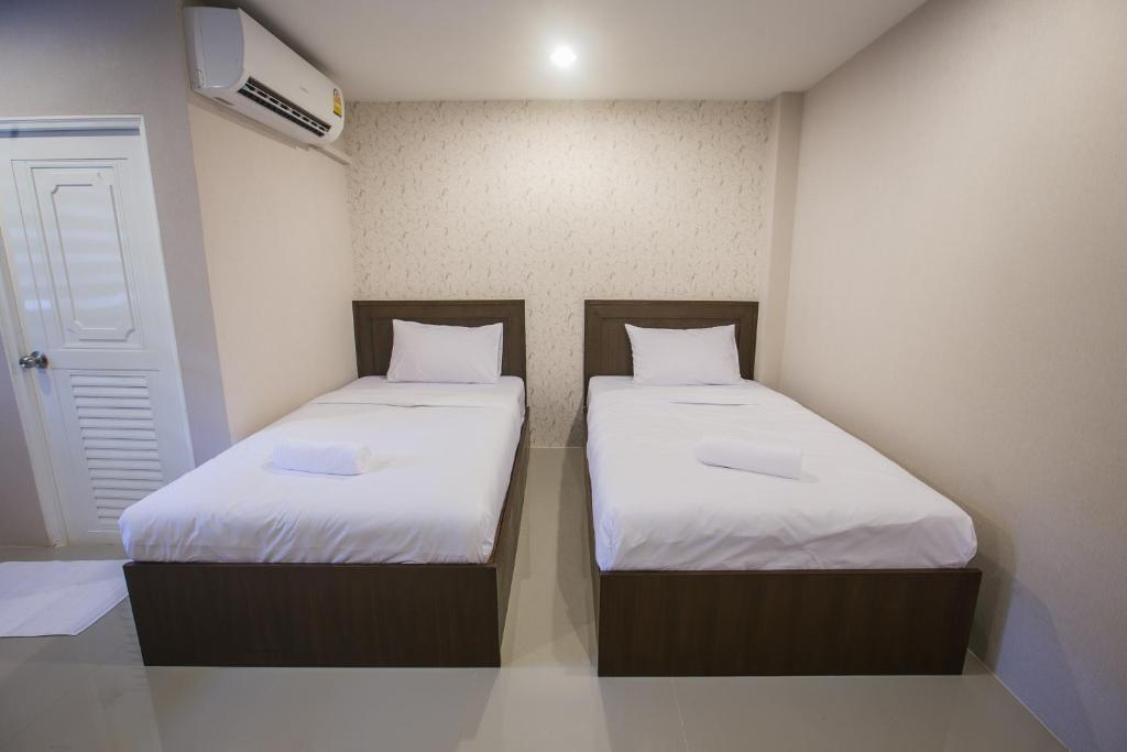 Postel nebo postele na pokoji v ubytování The Sleep Phang-nga