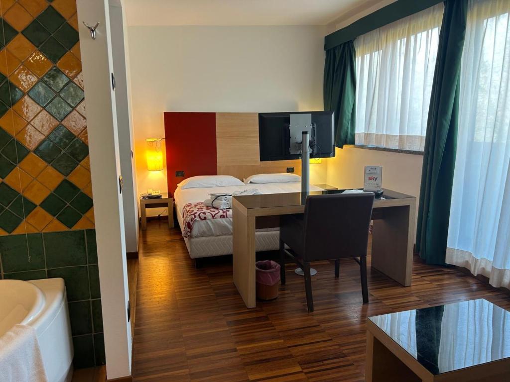Postel nebo postele na pokoji v ubytování Cascina Scova Resort