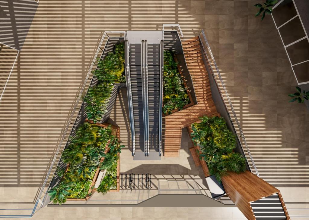 an overhead view of a staircase with plants at INNSiDE by Meliá Alicante Porta Maris in Alicante