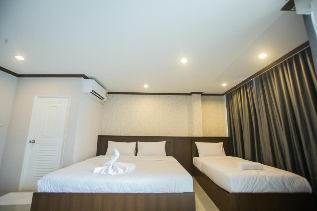 Postel nebo postele na pokoji v ubytování The Sleep Phang-nga