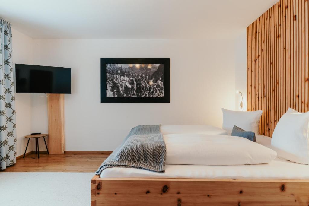 Postel nebo postele na pokoji v ubytování Hotel-Gasthof Der Wiesengrund