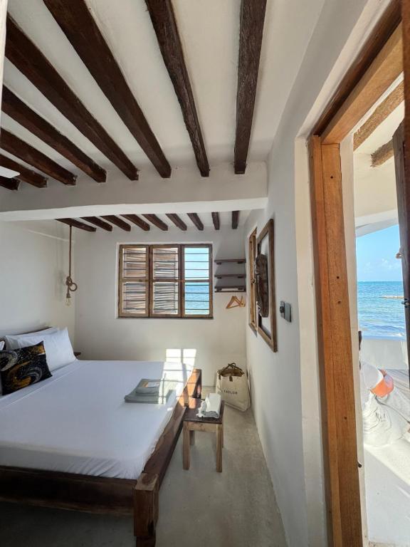 Postel nebo postele na pokoji v ubytování Mango Beach House