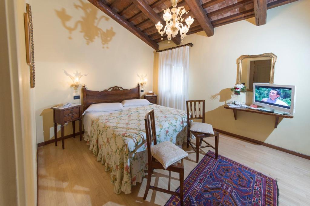 Voodi või voodid majutusasutuse Hotel La Rescossa toas