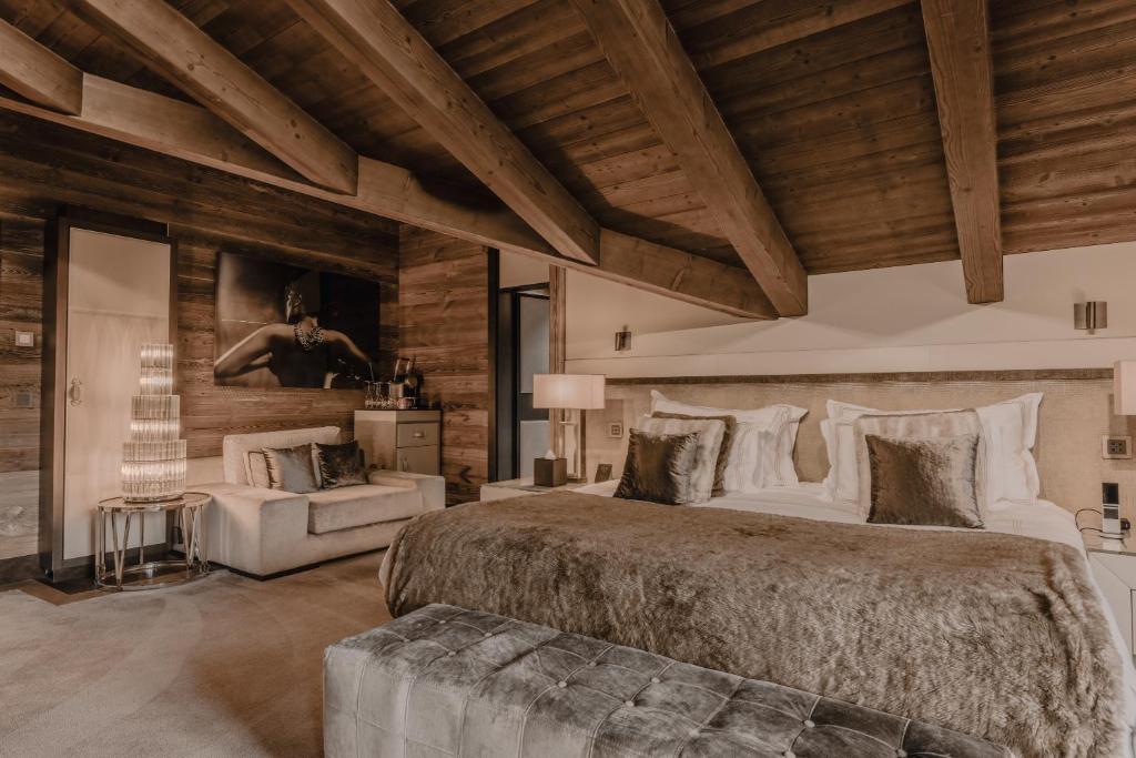 Postel nebo postele na pokoji v ubytování Ultima Hotel Gstaad