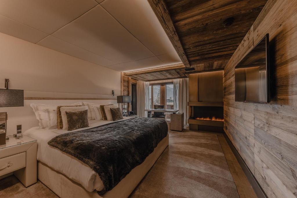 Postel nebo postele na pokoji v ubytování Ultima Hotel Gstaad