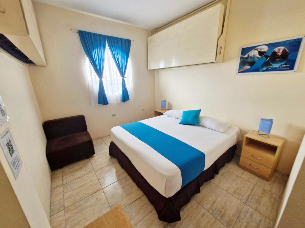 Postel nebo postele na pokoji v ubytování Hotel Crucero