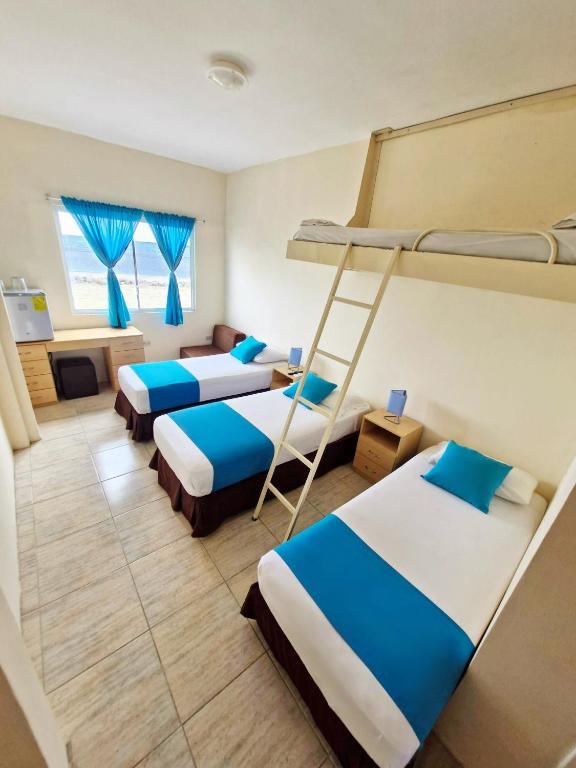 Postel nebo postele na pokoji v ubytování Hotel Crucero