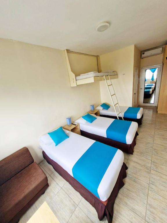 Postel nebo postele na pokoji v ubytování Hotel Crucero