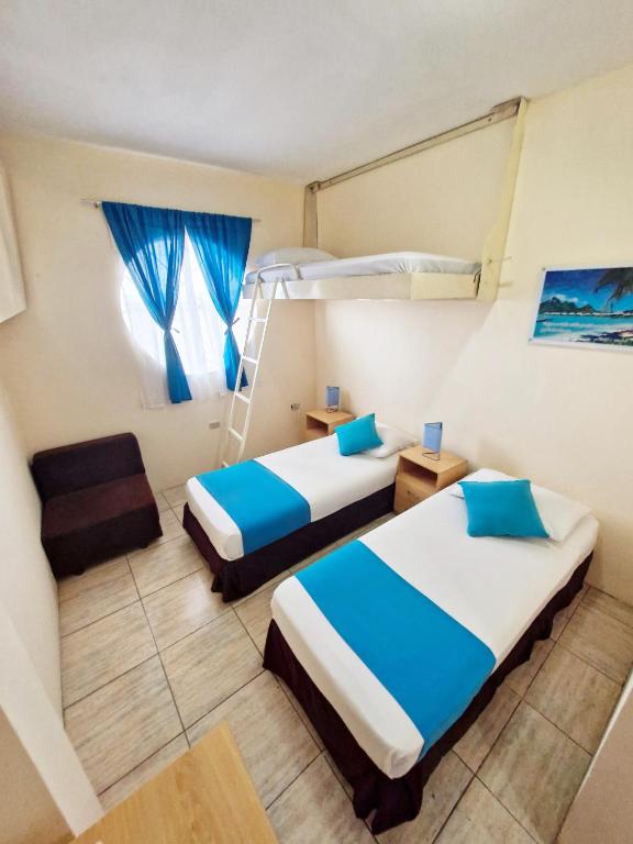 Postel nebo postele na pokoji v ubytování Hotel Crucero