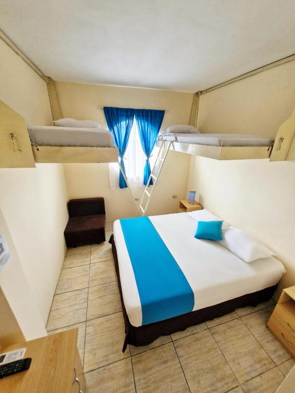 Postel nebo postele na pokoji v ubytování Hotel Crucero