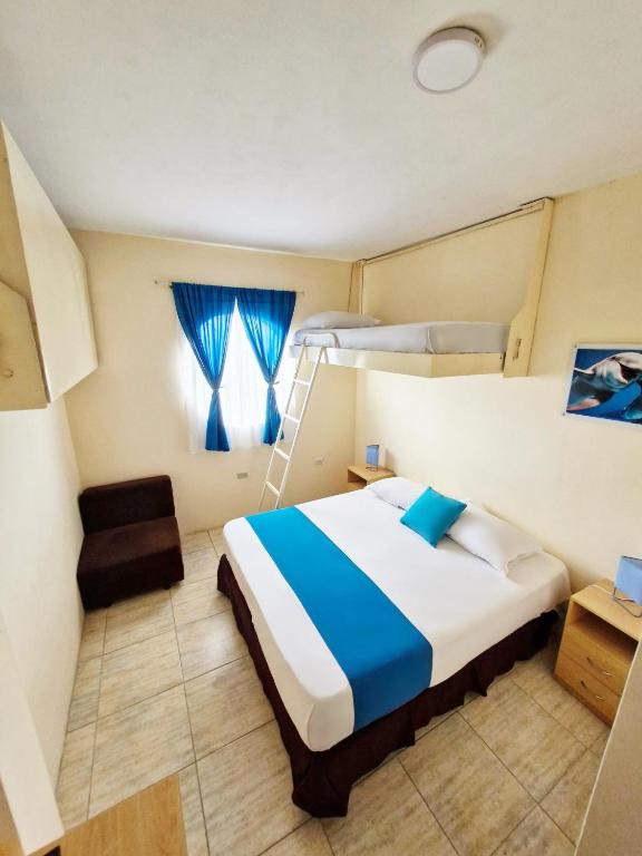Postel nebo postele na pokoji v ubytování Hotel Crucero