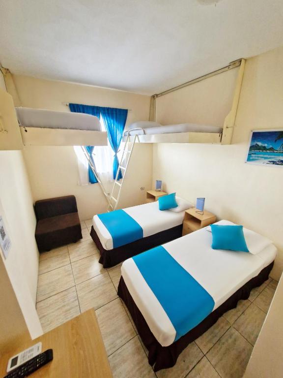 Postel nebo postele na pokoji v ubytování Hotel Crucero