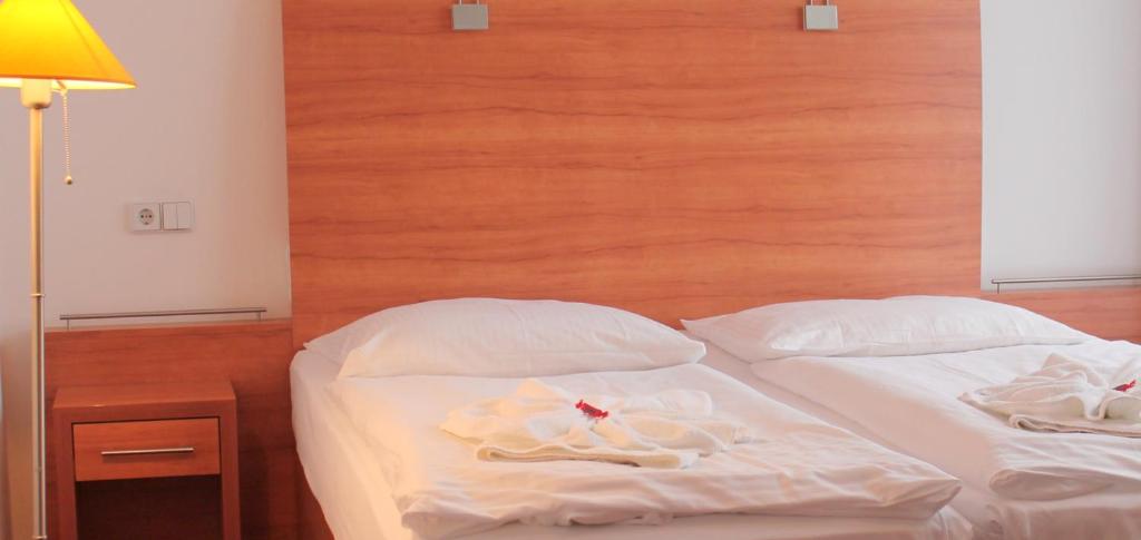 Postel nebo postele na pokoji v ubytování Hotel Kaiser