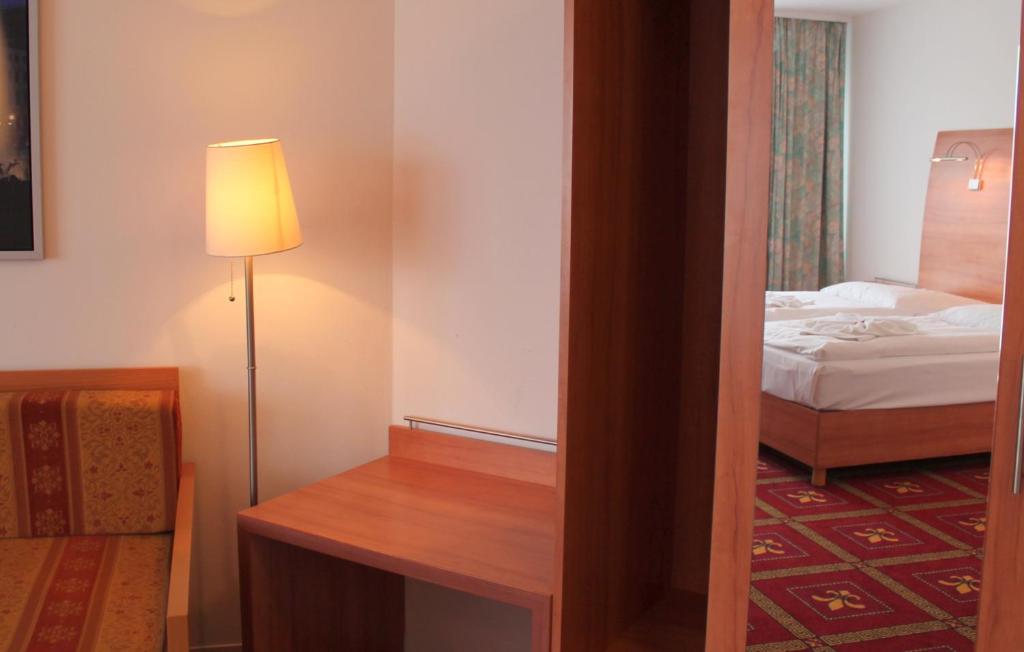 Postel nebo postele na pokoji v ubytování Hotel Kaiser