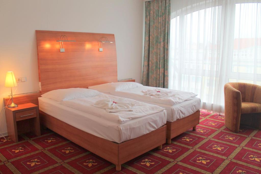 Postel nebo postele na pokoji v ubytování Hotel Kaiser