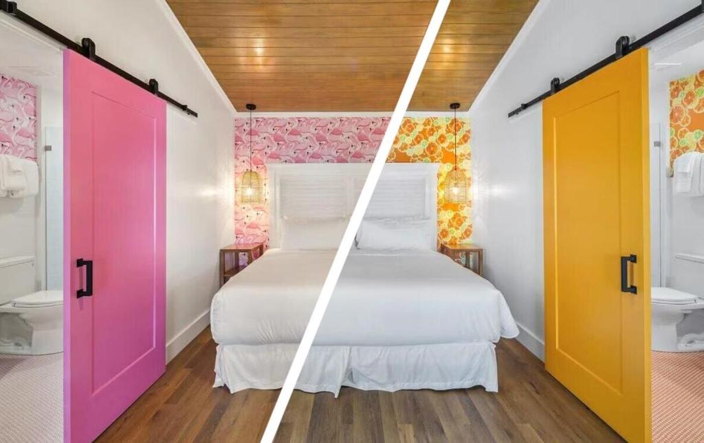 een slaapkamer met een bed en kleurrijke deuren bij Feather Queen at Custom House Inn in Key West