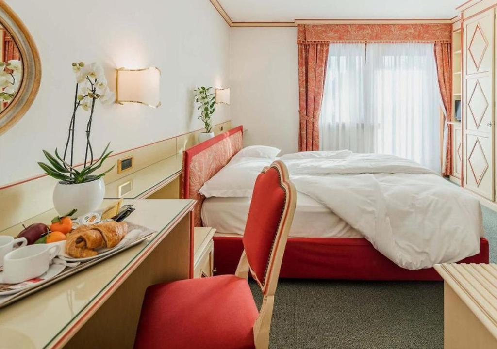 Postel nebo postele na pokoji v ubytování Chalet Stadio