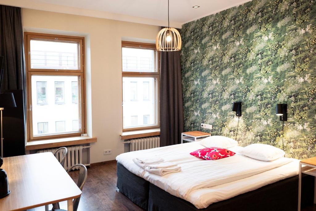 Postel nebo postele na pokoji v ubytování Hotel Finn