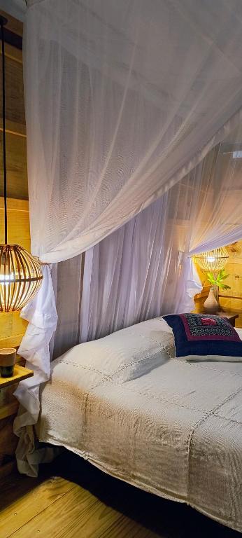 Postelja oz. postelje v sobi nastanitve Glamping Algodões