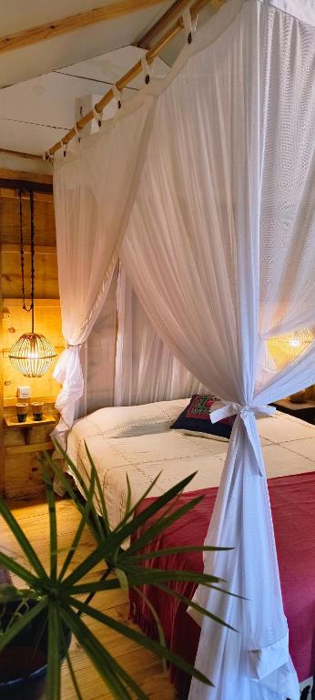 Postelja oz. postelje v sobi nastanitve Glamping Algodões