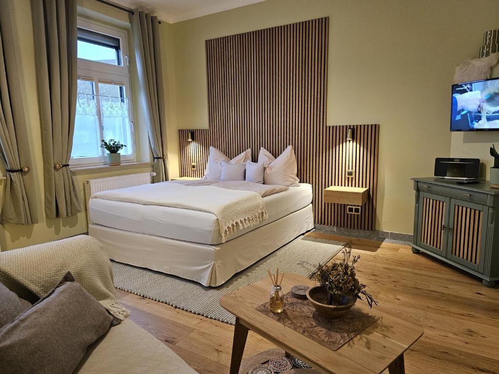 Giường trong phòng chung tại Ferienhof SchilfMeer - Fewo "Seepferdchen"