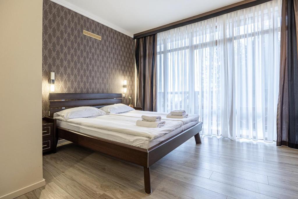 Postel nebo postele na pokoji v ubytování Forest Hill Hotel & SPA