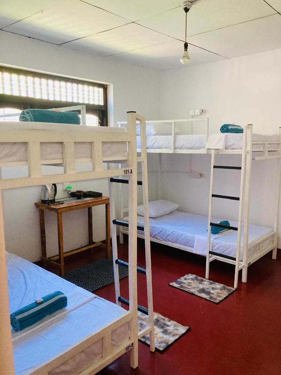Postel nebo postele na pokoji v ubytování Memo's Inn