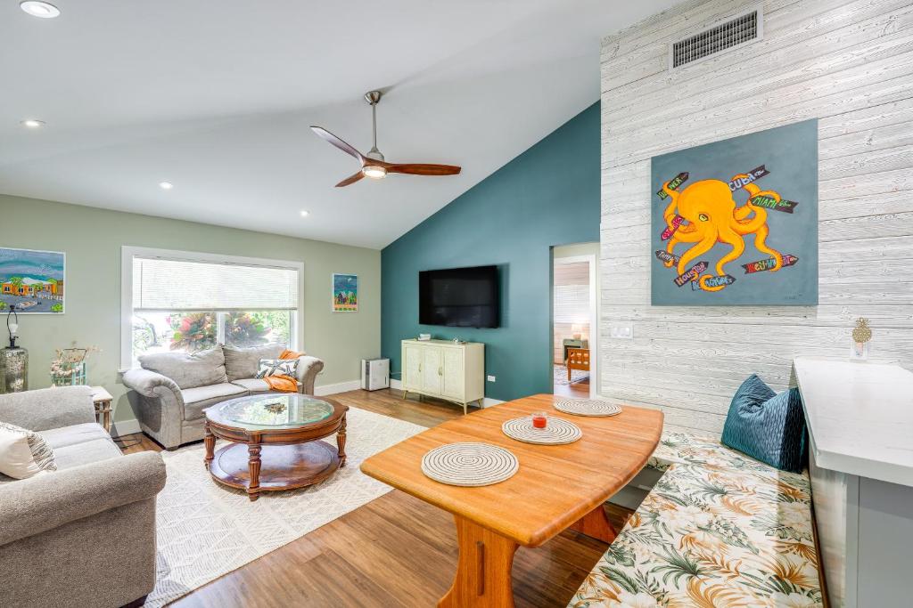 a living room with a couch and a table at Walk to Harry Harris Beach Modern Coastal Escape! in Tavernier