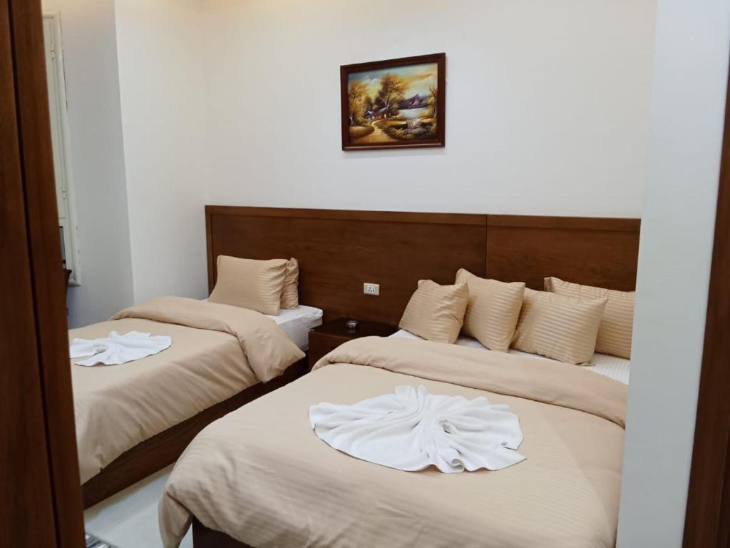 Postel nebo postele na pokoji v ubytování New Panorama Inn