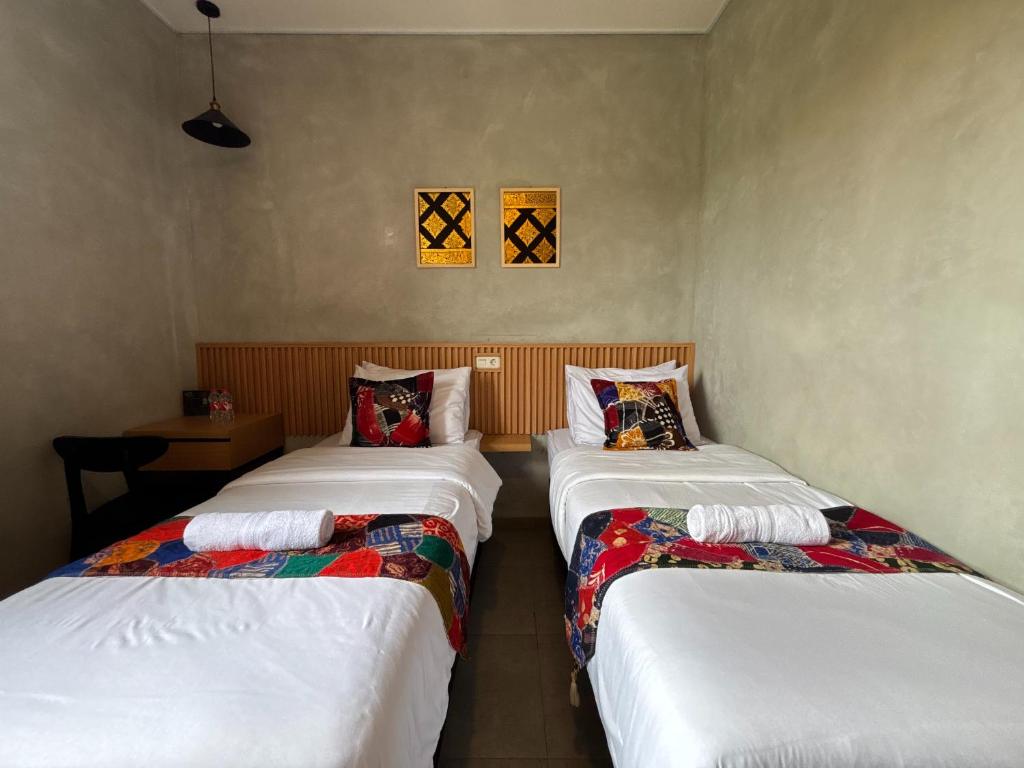 Letto o letti in una camera di The Cluster Harris