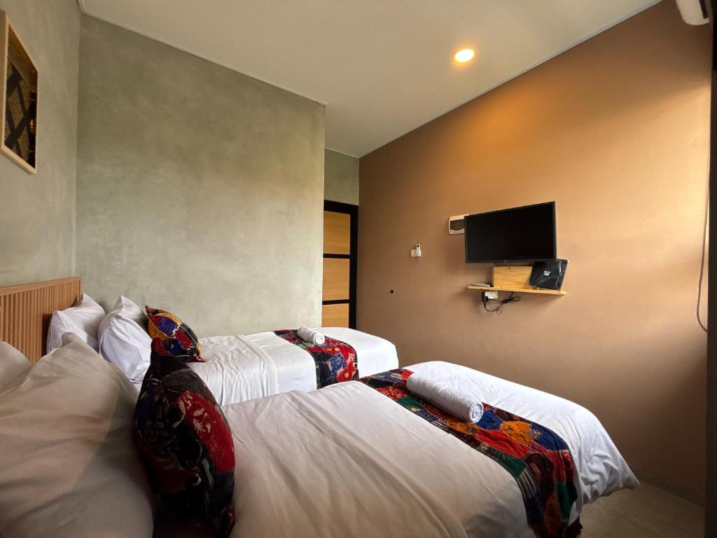 Letto o letti in una camera di The Cluster Harris