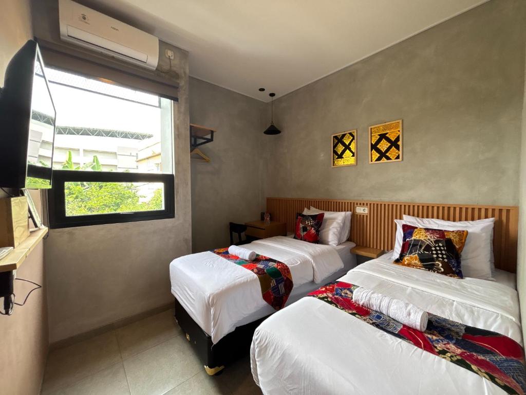 Letto o letti in una camera di The Cluster Harris
