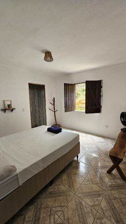 Postel nebo postele na pokoji v ubytování LahSelva Pousada e Hostel