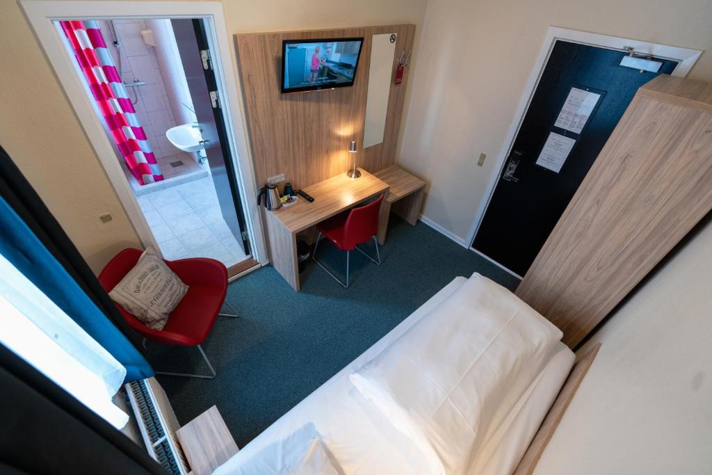 Ένα ή περισσότερα κρεβάτια σε δωμάτιο στο Prinsen Hotel