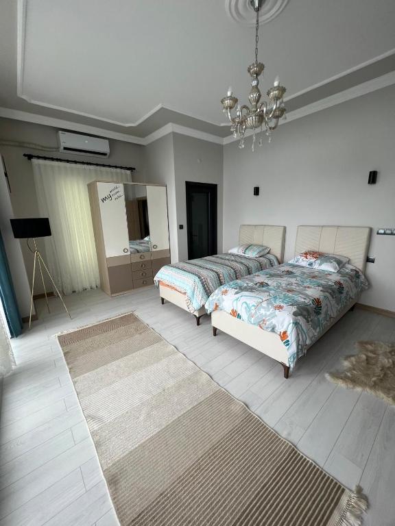 A bed or beds in a room at Çolakoglu konagı