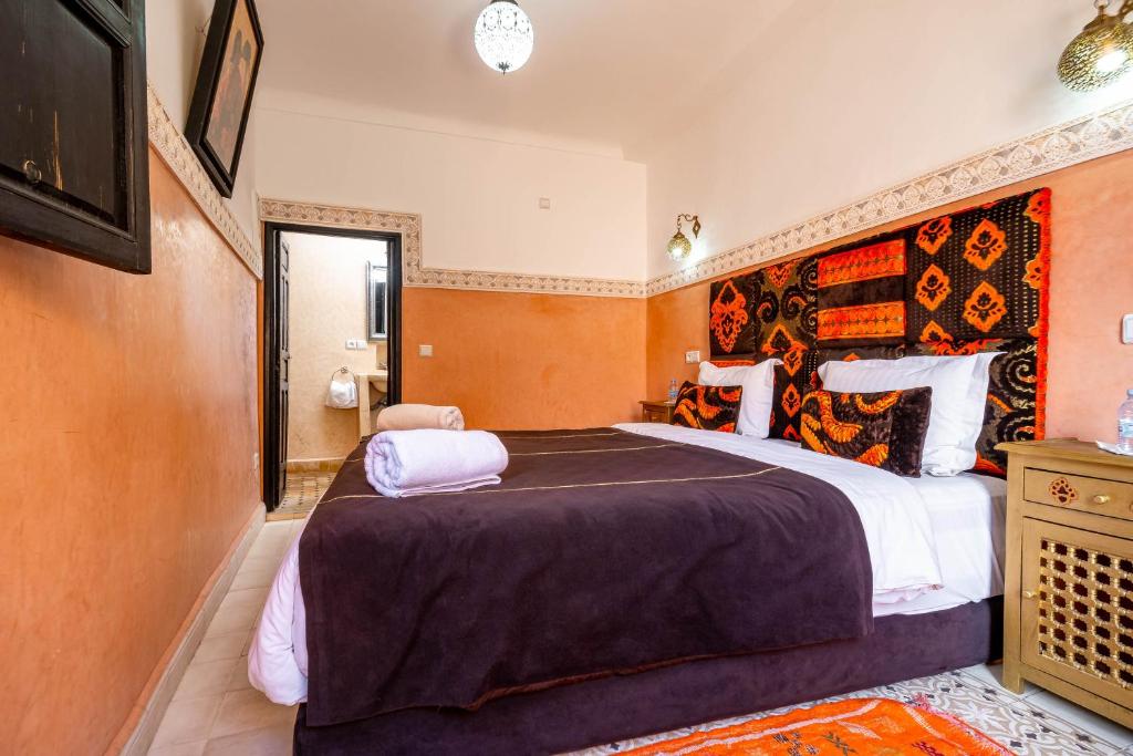 Postel nebo postele na pokoji v ubytování RIAD LA GAZELLE DU SUD