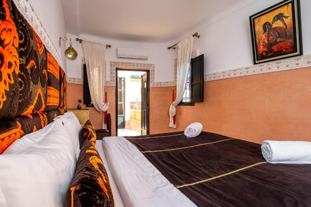 Postel nebo postele na pokoji v ubytování RIAD LA GAZELLE DU SUD