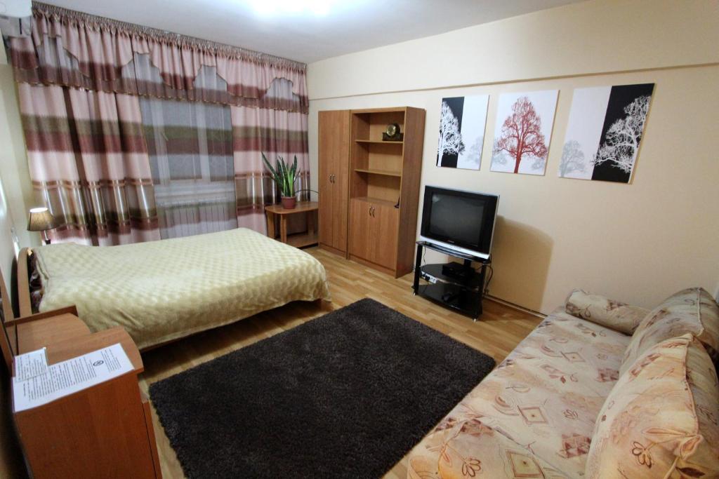 Ένα ή περισσότερα κρεβάτια σε δωμάτιο στο Nadezhda Apartment on Zhibek Zholy 33