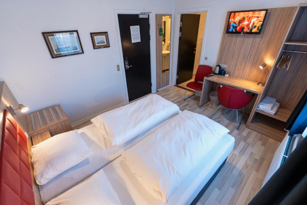 Ένα ή περισσότερα κρεβάτια σε δωμάτιο στο Prinsen Hotel