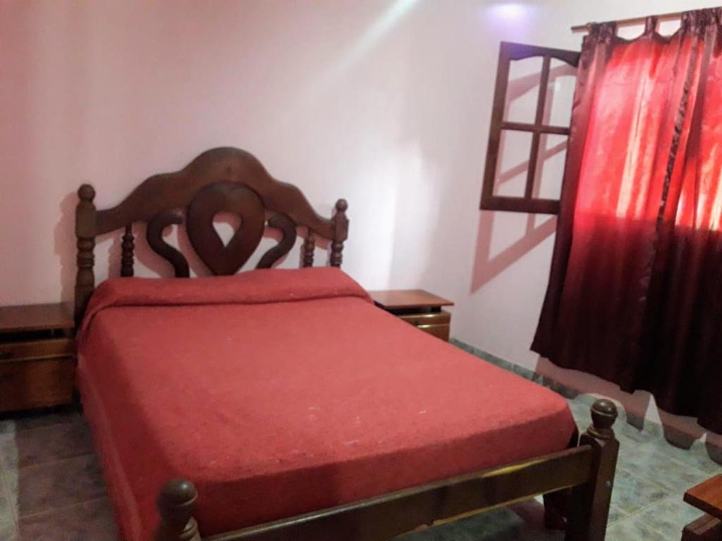 En eller flere senge i et værelse på Casa Rivadavia