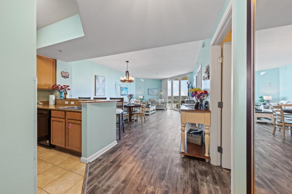 a kitchen and living room with a dining room at 5 Star Resort 11th Fl Stunning Sunrise 2BR 2BA King Suite,Pools ,Shuttle or Walk to Beach in Destin