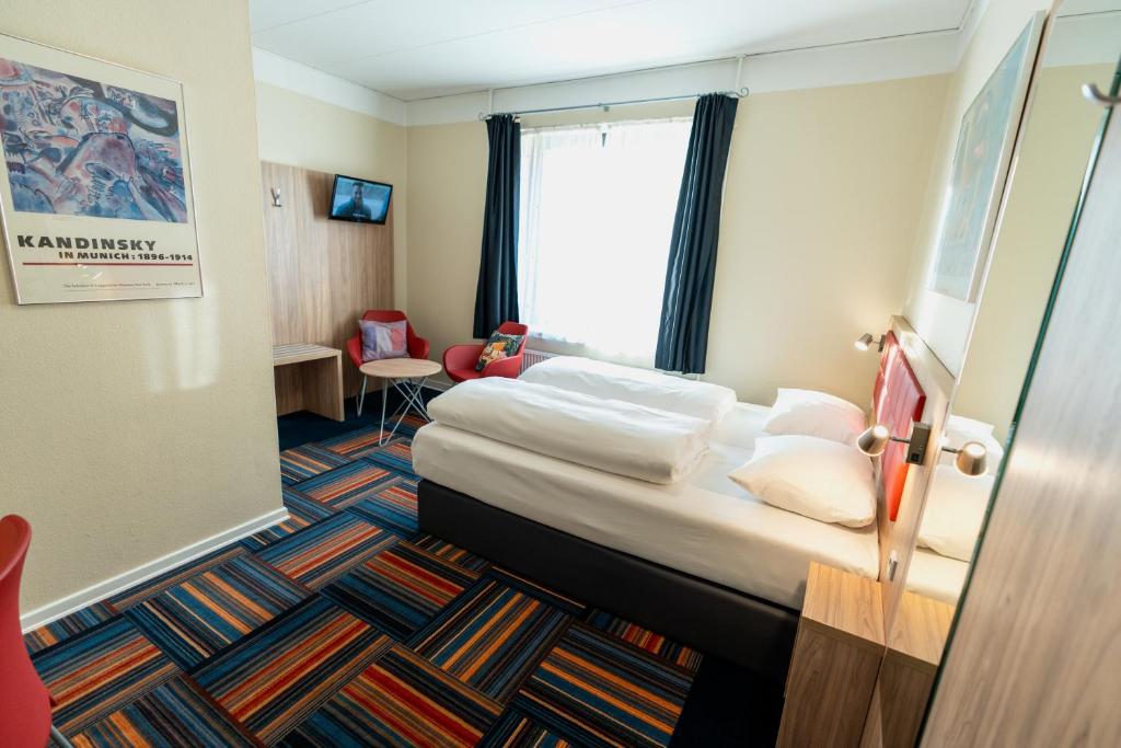 Ένα ή περισσότερα κρεβάτια σε δωμάτιο στο Prinsen Hotel
