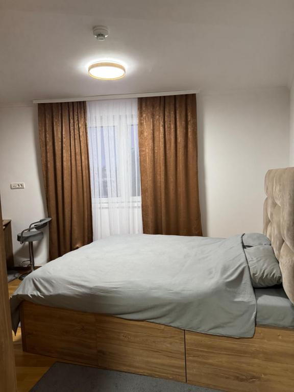 En eller flere senge i et værelse på Donk Apartment Kopaonik